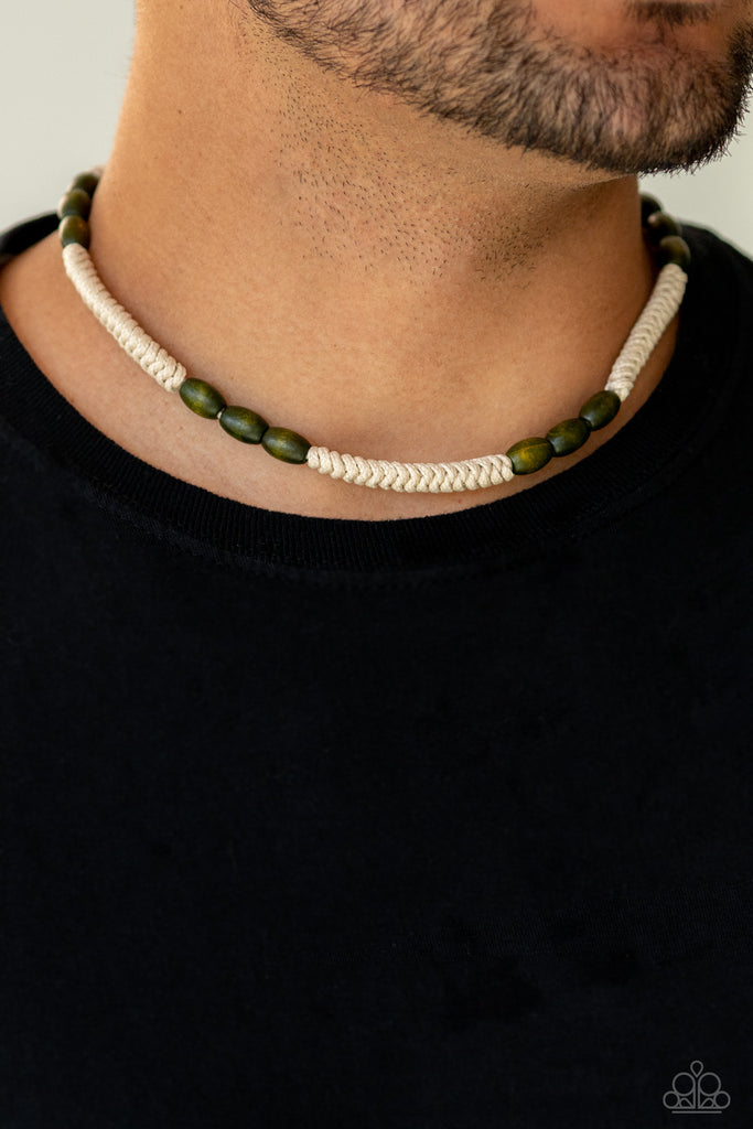 Tinted in the earthy shade of Military Olive, trios of wooden beads are strung along strands of white braided cording for a beach inspired look below the collar. Features a button loop closure.  Sold as one individual necklace.
