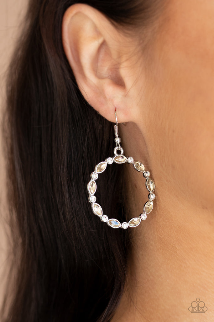 Encased in sleek silver frames, dainty white rhinestones and smoked topaz marquise gems delicately connect into a glittery hoop for a glamorous finish. Earring attaches to a standard fishhook fitting.  Sold as one pair of earrings.