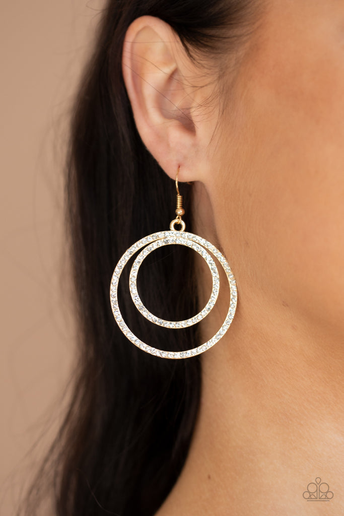 Encrusted in dainty white rhinestones, a pair of gold hoops delicately connect into a rippling frame for a glamorous finish. Earring attaches to a standard fishhook fitting.  Sold as one pair of earrings.  