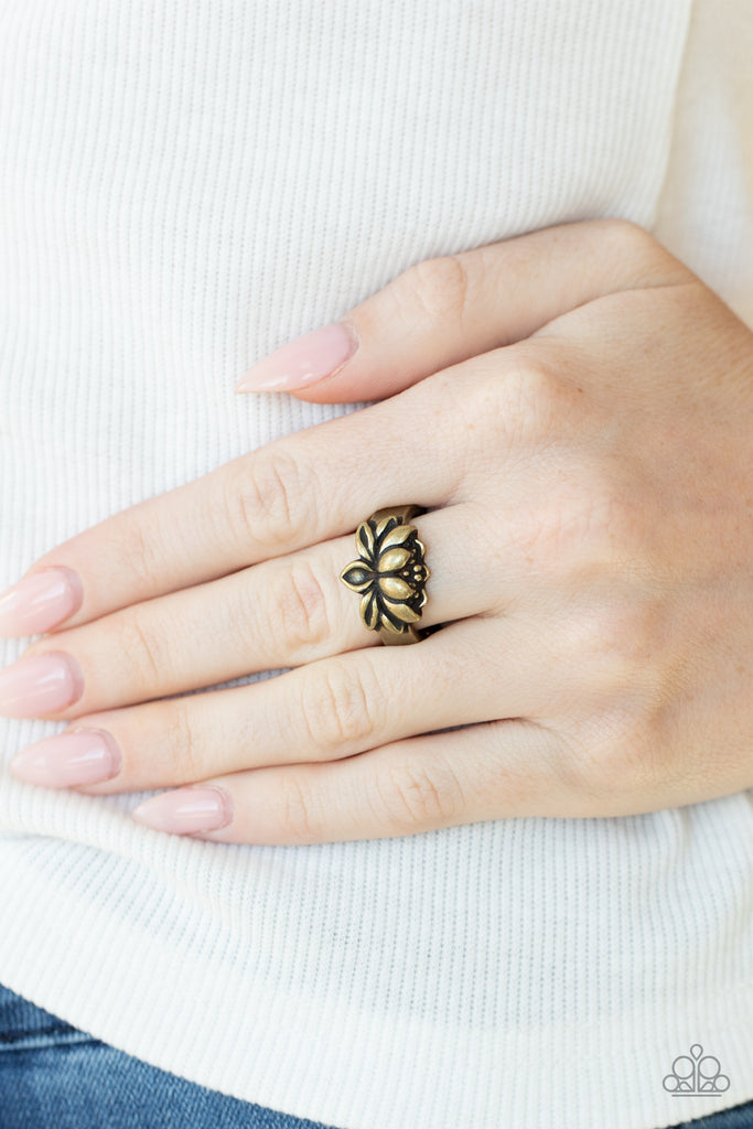 Brushed in antiqued shimmer, a lifelike brass lotus embellishes the center of a dainty brass band for a whimsical look. Features a dainty stretchy band for a flexible fit.  Sold as one individual ring.  New Kit