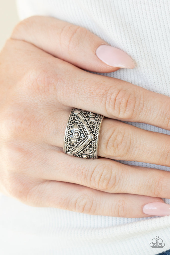 Brushed in a rustic finish, a thick silver frame is dotted and studded in tribal inspired patterns for an artisan inspired look. Features a stretchy band for a flexible fit.  Sold as one individual ring.  