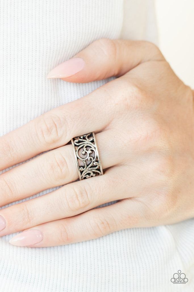 Brushed in an antiqued shimmer, shiny silver filigree vines across the finger for a simple seasonal look. Features a dainty stretchy band for a flexible fit.  Sold as one individual ring.