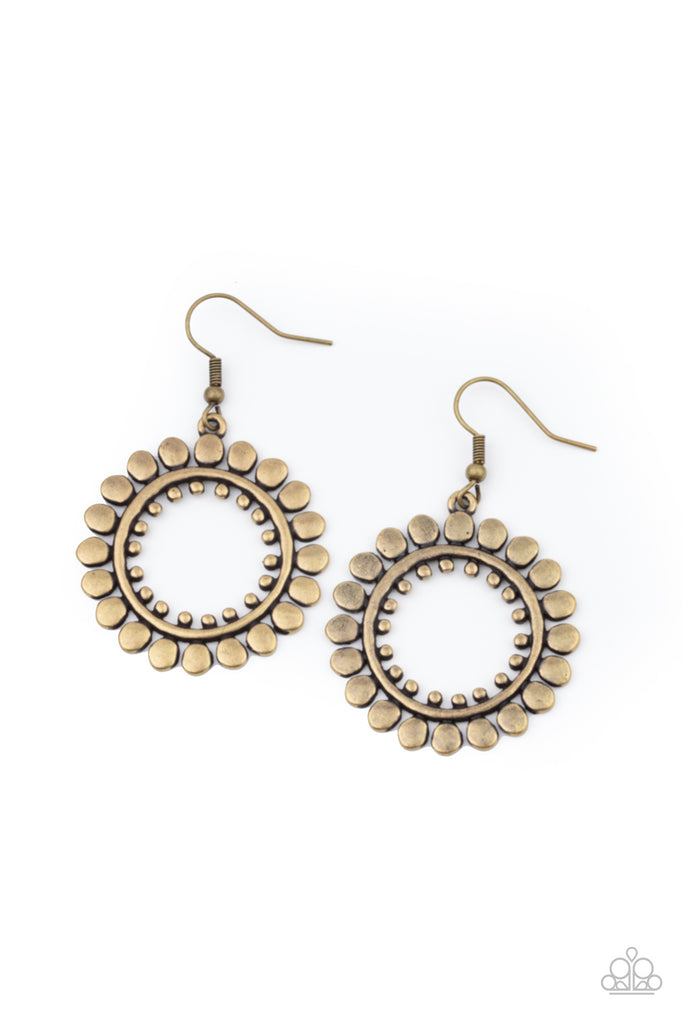 Asymmetrical brass discs flare out from an antiqued brass ring featuring an airy brass studded center, creating a radiant hoop. Earring attaches to a standard fishhook fitting.  Sold as one pair of earrings.