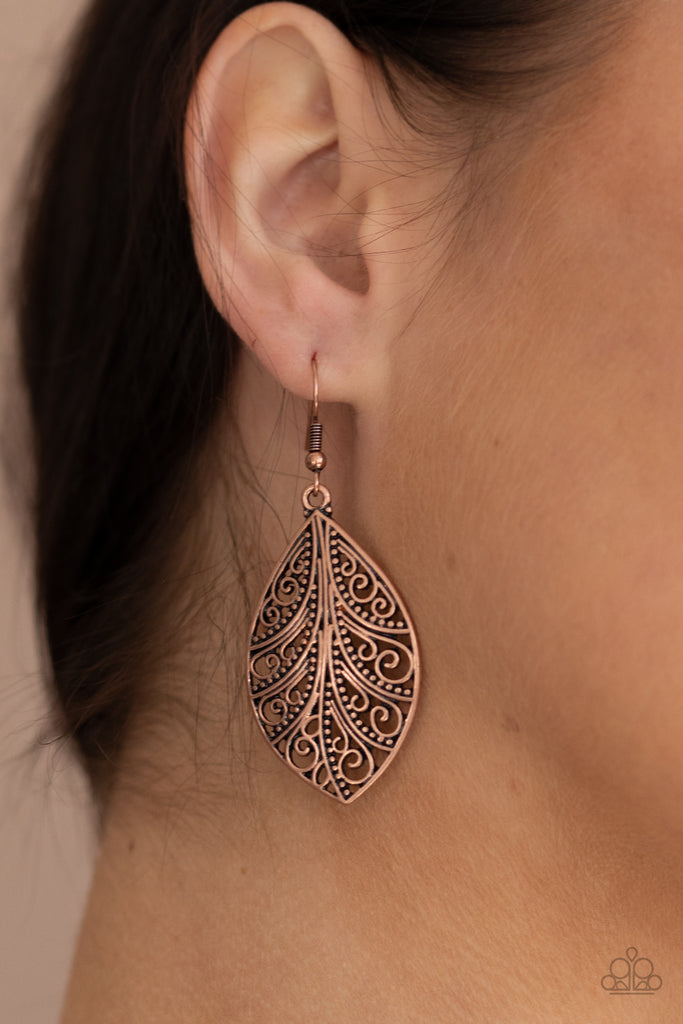 Smooth and studded vine-like filigree swirls across the front of a copper frame, creating a whimsical piece. Earring attaches to a standard fishhook fitting.  Sold as one pair of earrings.  