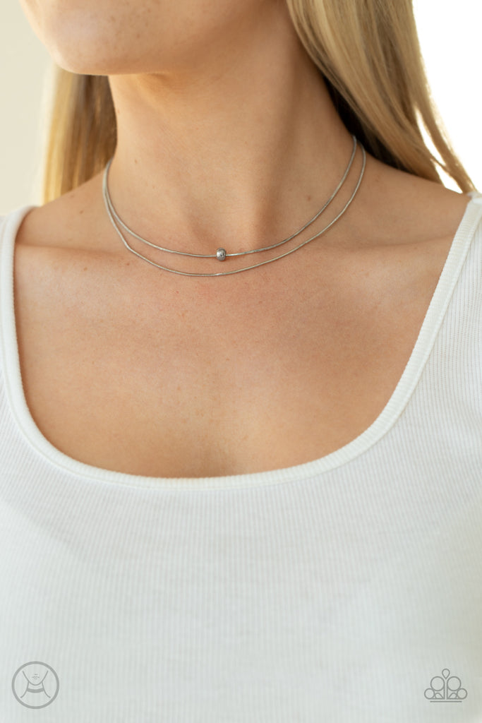 Infused with a single silver bead, two dainty rows of rounded snake chain layer around the neck for a seamlessly chic look. Features an adjustable clasp closure.  Sold as one individual choker necklace. Includes one pair of matching earrings.