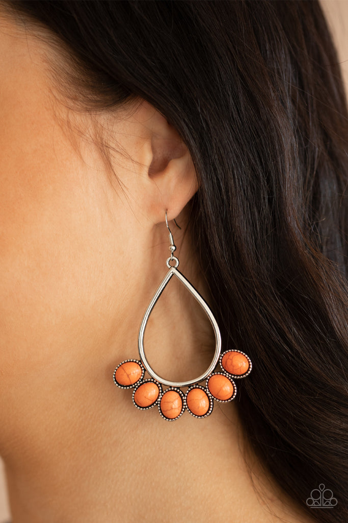 Featuring decorative silver fittings, smooth orange stones fan out from the bottom of an airy silver teardrop frame for a seasonal flair. Earring attaches to a standard fishhook fitting.  Sold as one pair of earrings.