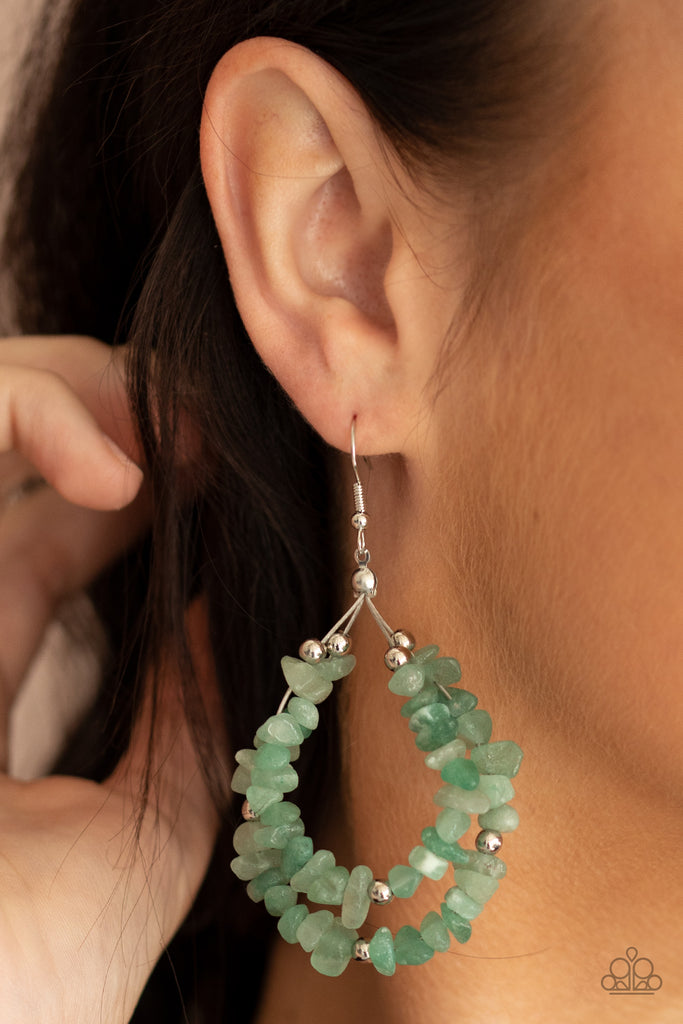 An earthy collection of raw green stones and dainty silver beads are threaded along two dainty silver wires, layering into an earthy teardrop. Earring attaches to a standard fishhook fitting.  Sold as one pair of earrings.