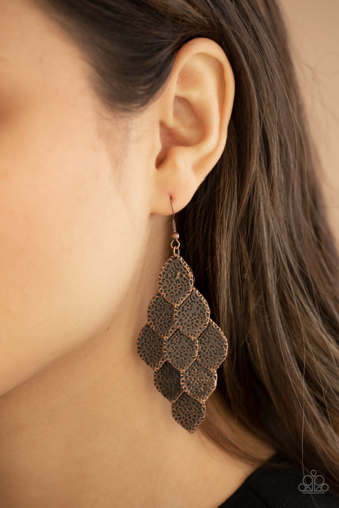 Hammered in antiqued details, leafy copper frames cascade from the ear, creating a rustic lure. Earring attaches to a standard fishhook fitting.  Sold as one pair of earrings.