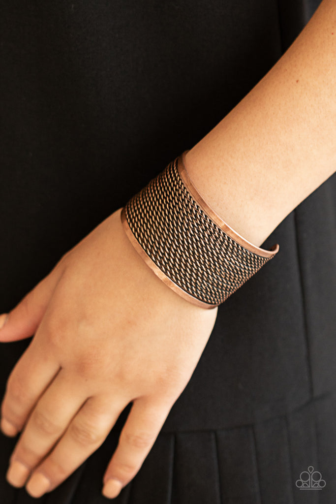 Twisted rows of antiqued copper wires layer between two flat copper bars, coalescing into a boldly stacked cuff around the wrist.  Sold as one individual bracelet.