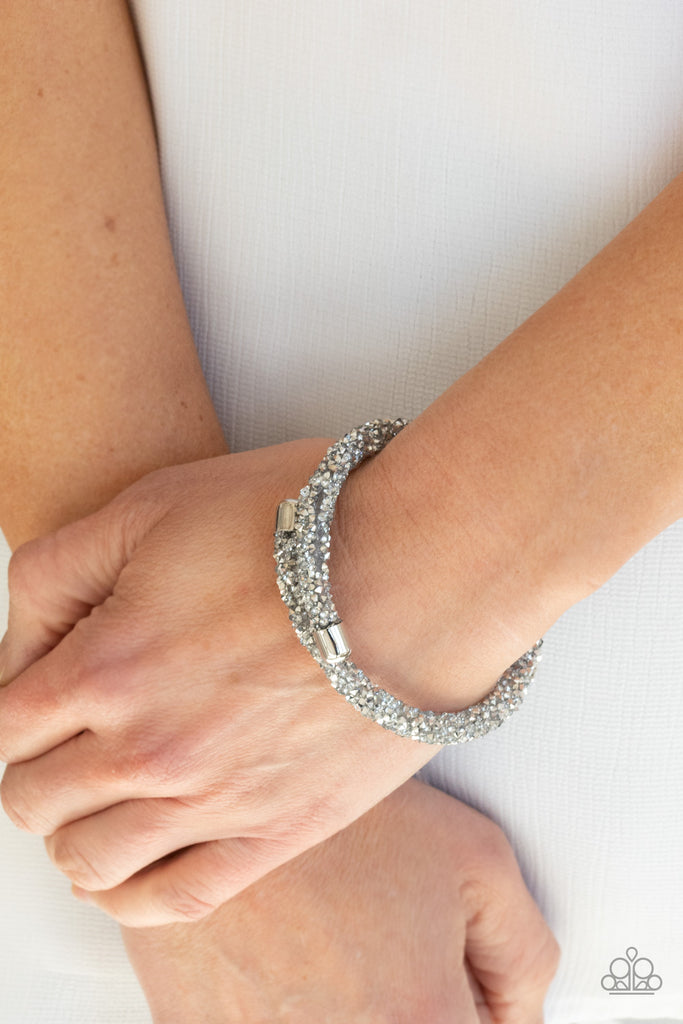 As if rolled in glitter, a seemingly infinite collection of metallic flecked and glassy white rhinestones adorns a flexible band that delicately coils around the wrist for a sparkly versatile fit.  Sold as one individual bracelet.  New Kit