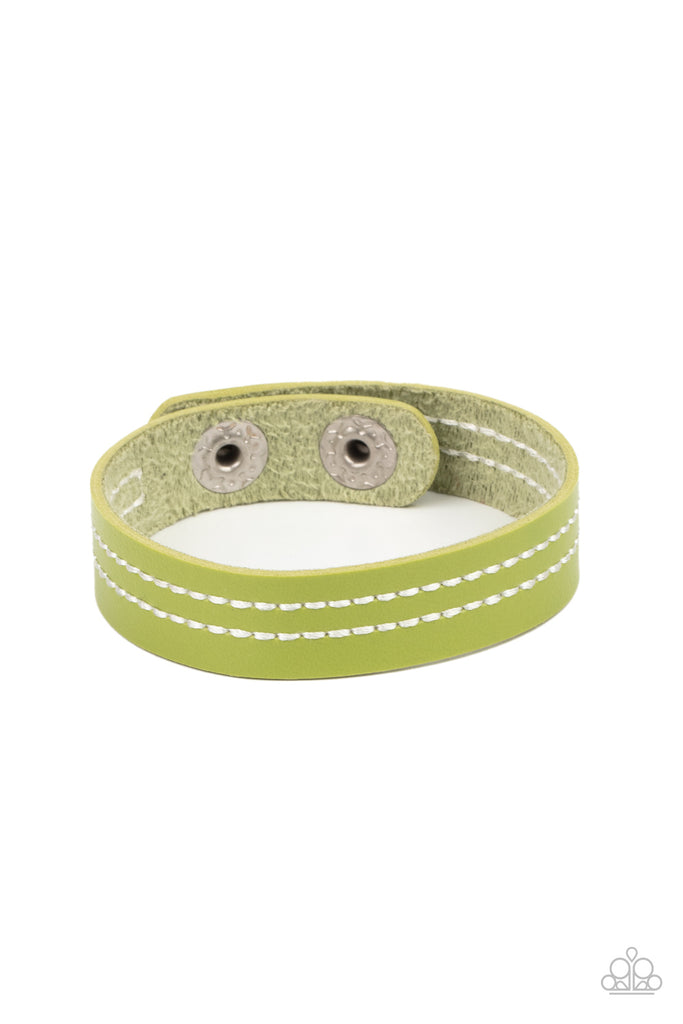 The front of a dainty green leather band is stitched in two linear rows, creating a colorfully rustic centerpiece around the wrist. Features an adjustable snap closure.  Sold as one individual bracelet.