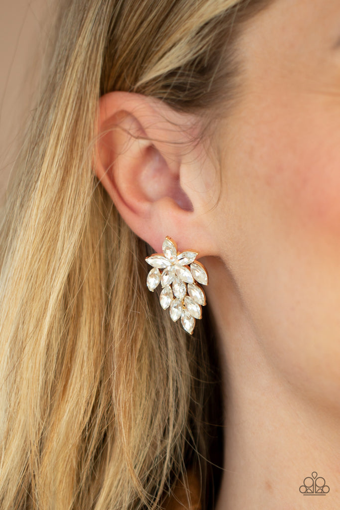 Featuring dainty gold studded accents, a sparkly collection of marquise cut white rhinestones flare out from the bottom of floral arranged rhinestones for a flauntable finish. Earring attaches to a standard post fitting.  Sold as one pair of post earrings.