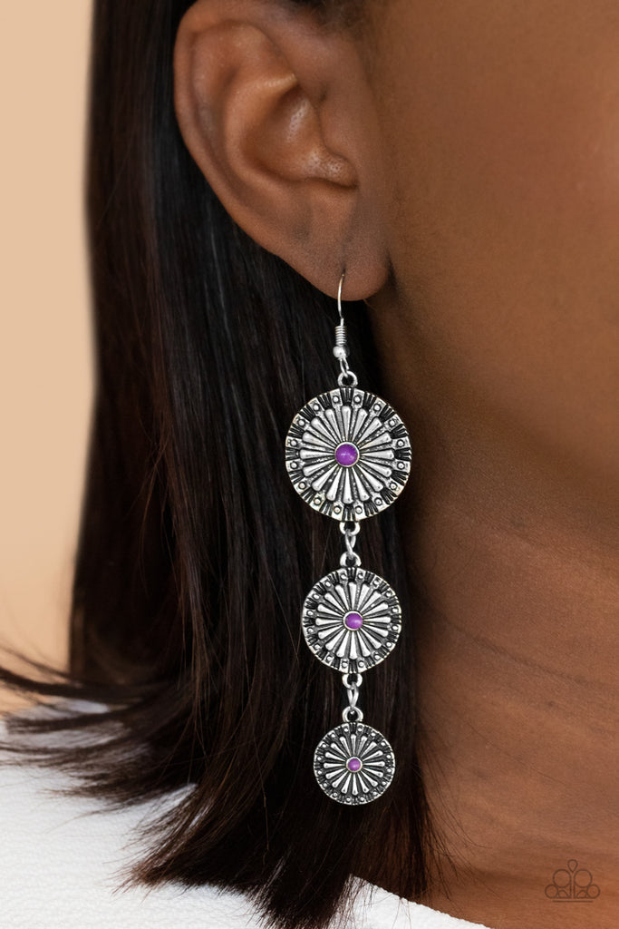 Dotted with dainty purple beads, rustic silver floral frames gradually decrease in size as they swing from the ear, creating a colorful lure. Earring attaches to a standard fishhook fitting.  Sold as one pair of earrings.