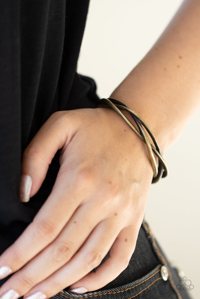 Rustic brass bars braid across the wrist, creating a boldly plaited cuff.  Sold as one individual bracelet.