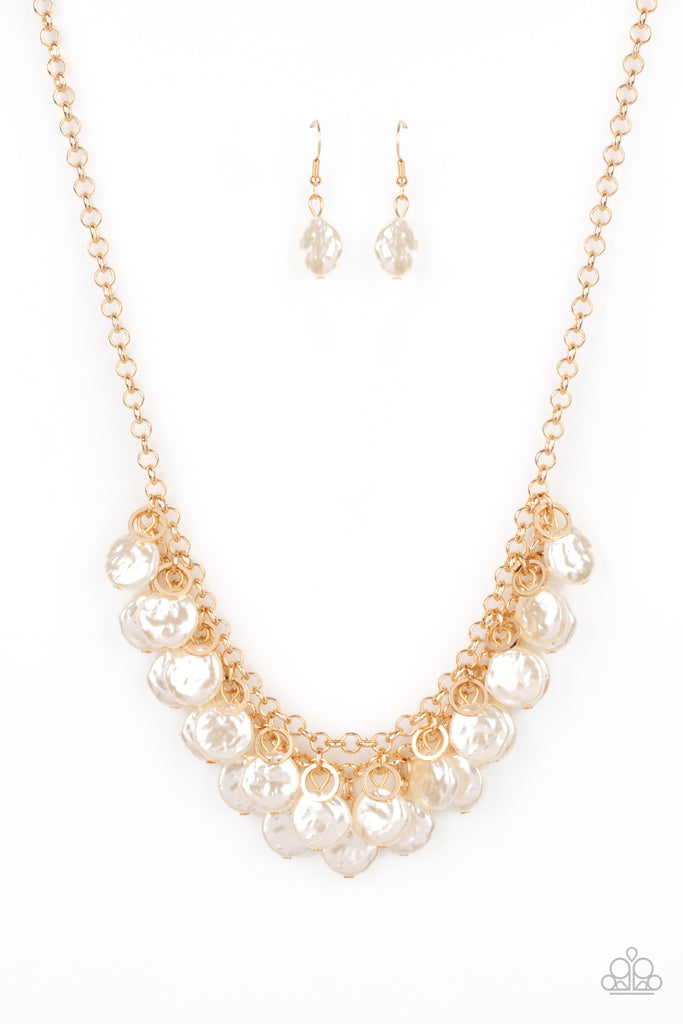 Featuring delicately hammered surfaces, rows of pearly white beads cascade from the bottoms of interlocking gold chains. Dainty gold rings swing from the top of the timelessly tiered display, creating a refined fringe below the collar. Features an adjustable clasp closure.  Sold as one individual necklace. Includes one pair of matching earrings.