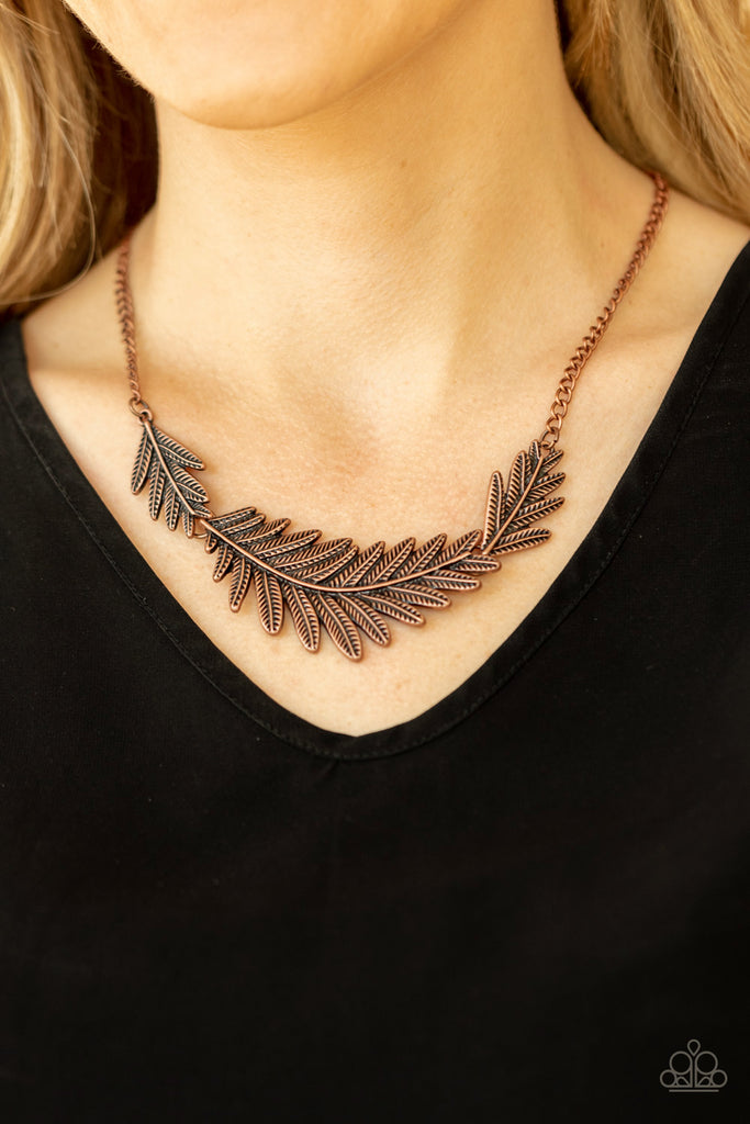 Etched and embossed in lifelike textures, leafy copper plates connect into a dramatic feather below the collar for a seasonal statement. Features an adjustable clasp closure.  Sold as one individual necklace. Includes one pair of matching earrings.  New Kit