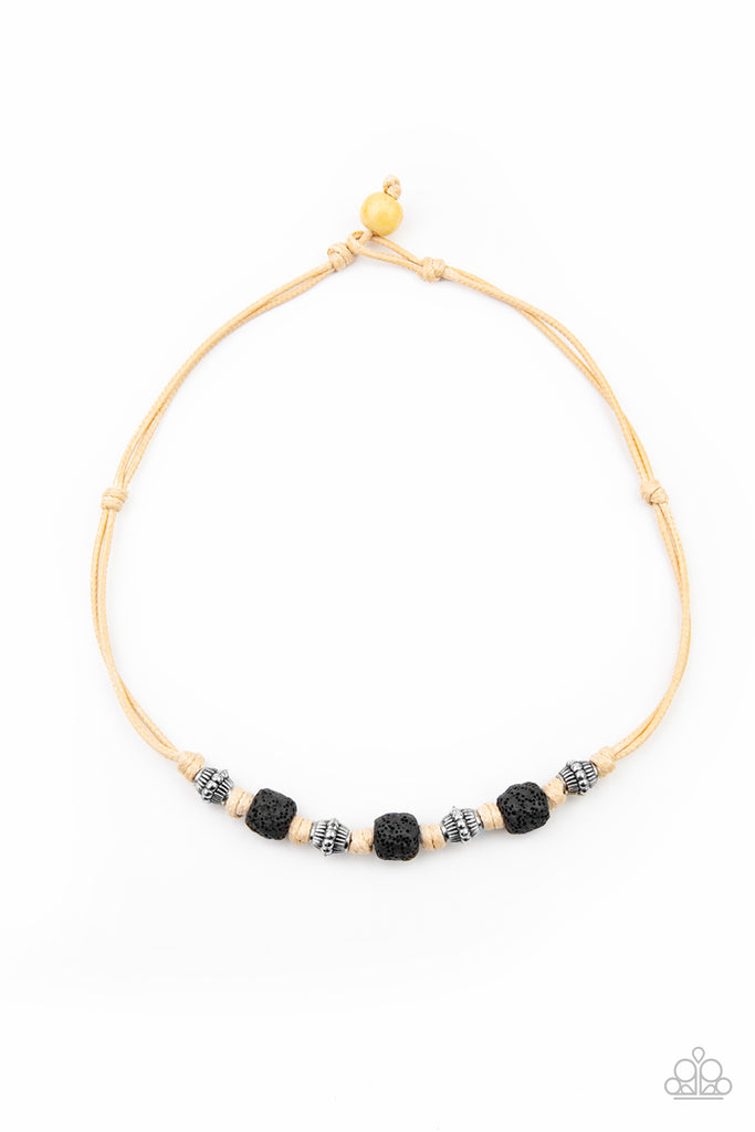Decorative silver beads and pieces of black pumice-like rock are knotted in place below the collar for a seasonal look. Features a button loop closure.  Sold as one individual necklace.  