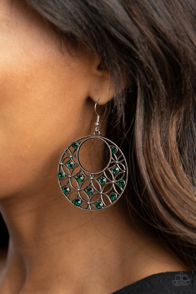Dotted with glittery green rhinestones, an airy backdrop of antiqued flowers climb a studded silver hoop for a whimsical look. Earring attaches to a standard fishhook fitting.  Sold as one pair of earrings.