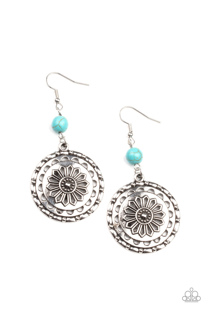 A refreshing turquoise stone bead gives way to a studded silver frame embossed in a whimsical daisy pattern, creating a rustic lure. Earring attaches to a standard fishhook fitting.  Sold as one pair of earrings.