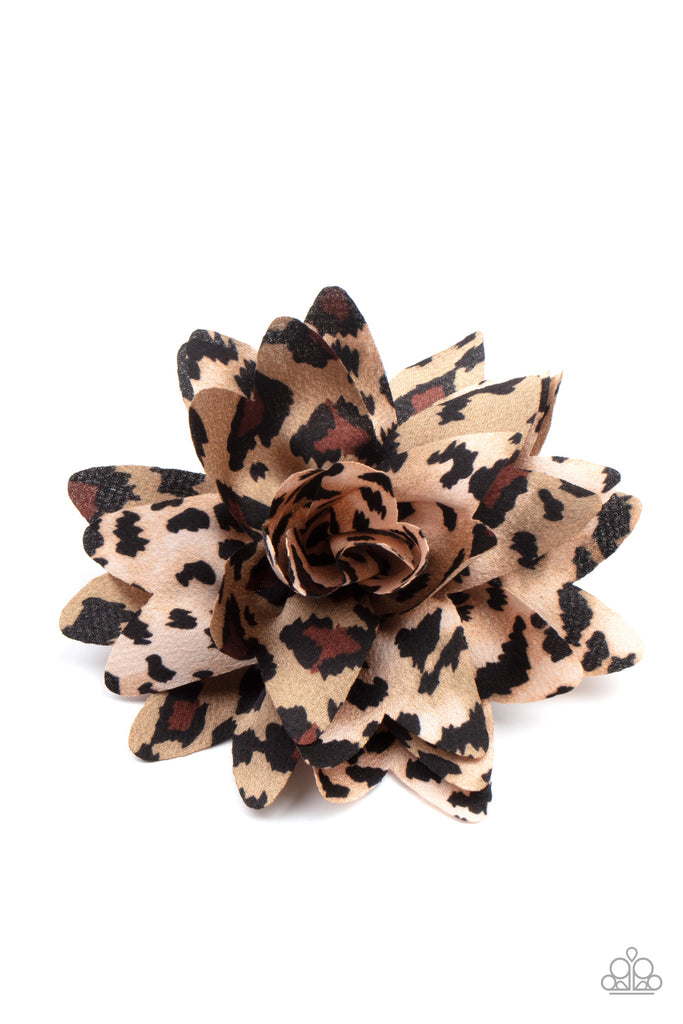Featuring animal inspired patterns, mismatched petals gather into a wildly wonderful blossom. Features a standard hair clip on the back.  Sold as one individual hair clip.