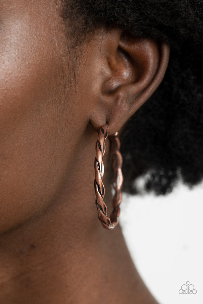 Brushed in an antiqued shimmer, rustic copper bars delicately twist into a rustic hoop. Earring attaches to a standard post fitting. Hoop measures approximately 1 3/4" in diameter.  Sold as one pair of hoop earrings.