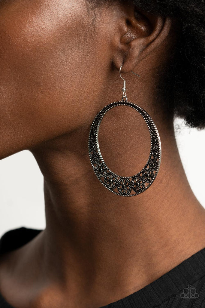 Dotted with dainty black rhinestones, studded wheel-like frames connect into a studded hoop for a whimsical look. Earring attaches to a standard fishhook fitting.  Sold as one pair of earrings.