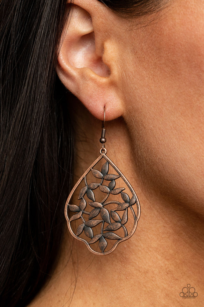 Leafy copper filigree climbs the center of a scalloped copper frame, creating a whimsically seasonal display. Earring attaches to a standard fishhook fitting.  Sold as one pair of earrings.  