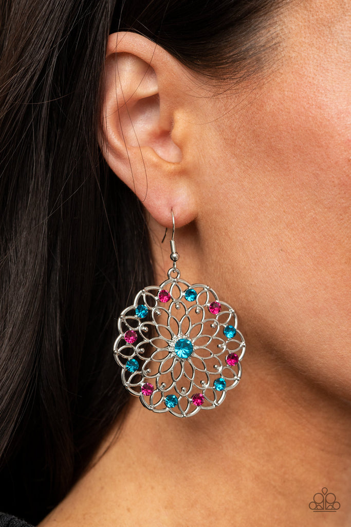 Sparkly blue and pink rhinestones dot shimmery silver petals that fan out into a colorful blossom, creating a glittery floral frame. Earring attaches to a standard fishhook fitting.  Sold as one pair of earrings.