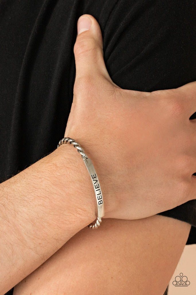 Twisted silver bars attach to a shiny silver plate stamped in the word, "BELIEVE," creating an inspiring cuff around the wrist.  Sold as one individual bracelet.