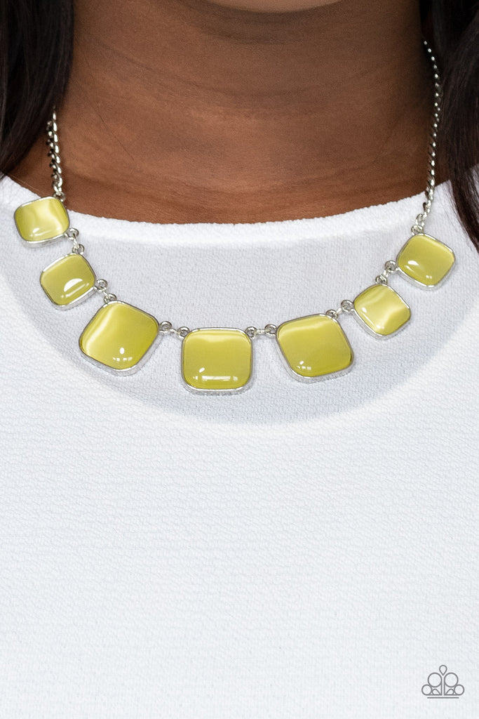Encased in square silver fittings, a dewy collection of Illuminating cat's eye stones gradually increase in size as they link below the collar for a whimsical pop of color. Features an adjustable clasp closure.  Sold as one individual necklace. Includes one pair of matching earrings.