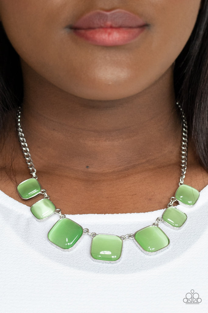 Encased in square silver fittings, a dewy collection of green cat's eye stones gradually increase in size as they link below the collar for a whimsical pop of color. Features an adjustable clasp closure.  Sold as one individual necklace. Includes one pair of matching earrings.