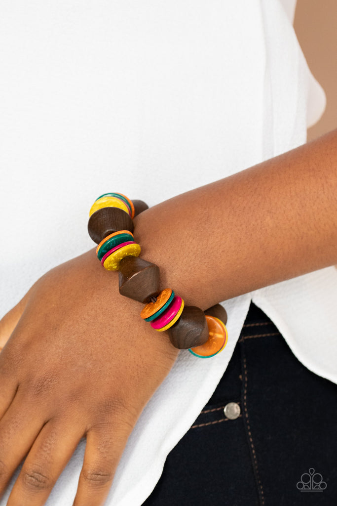 Multicolored wooden discs and chunky brown wooden beads are threaded along a stretchy band around the wrist, creating a summery look.  Sold as one individual bracelet.  New Kit