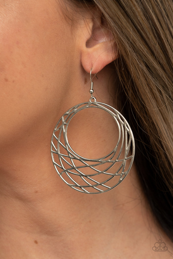Shimmery silver bars crisscross and overlap along the bottom of a circular frame, creating a crescent-like hoop. Earring attaches to a standard fishhook fitting.  Sold as one pair of earrings.  