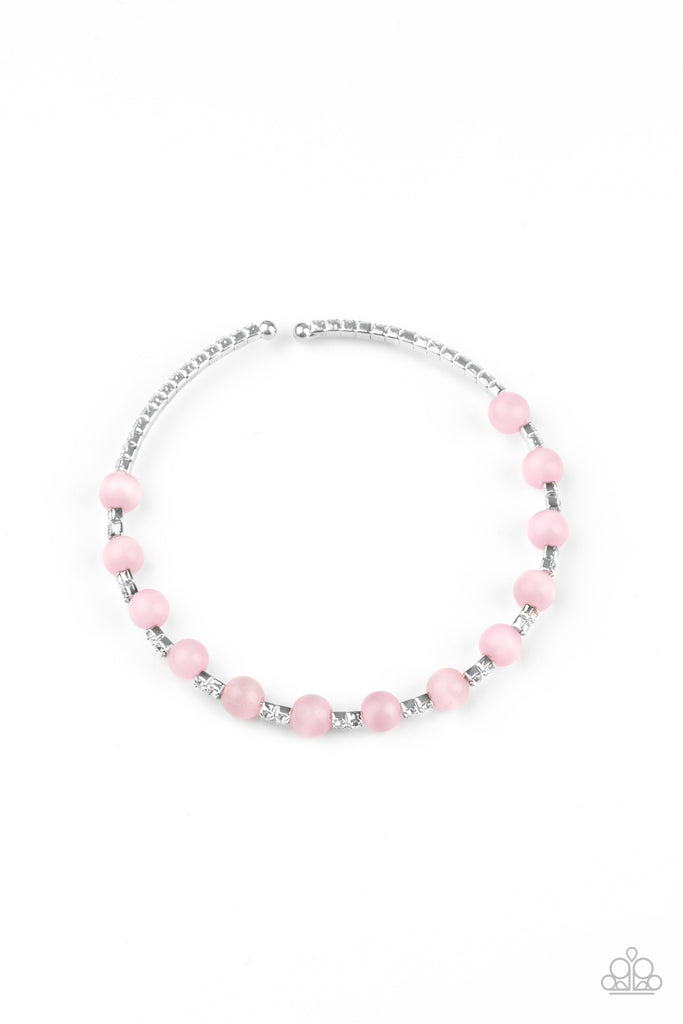 Glassy pink cat's eye stones are fitted in place along a dainty strand of glassy white rhinestones, creating a twinkly cuff around the wrist.  Sold as one individual bracelet.  