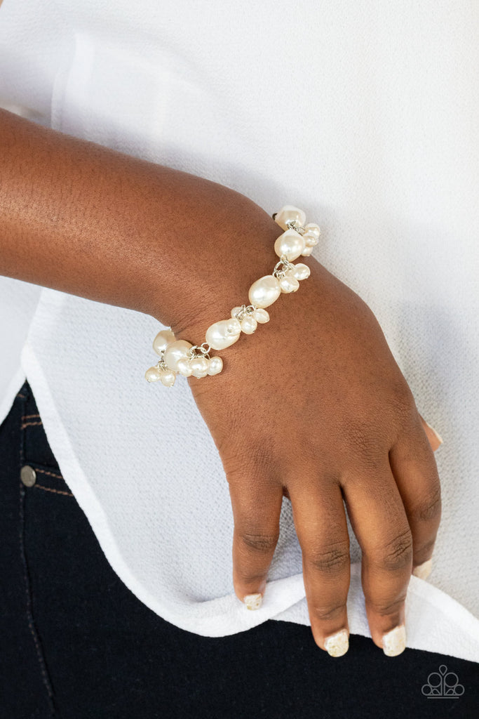 Featuring imperfect finishes, clusters of dainty pearly beads and pearly faceted beads delicately link around the wrist, creating a timeless fringe. Features an adjustable clasp closure.  Sold as one individual bracelet.