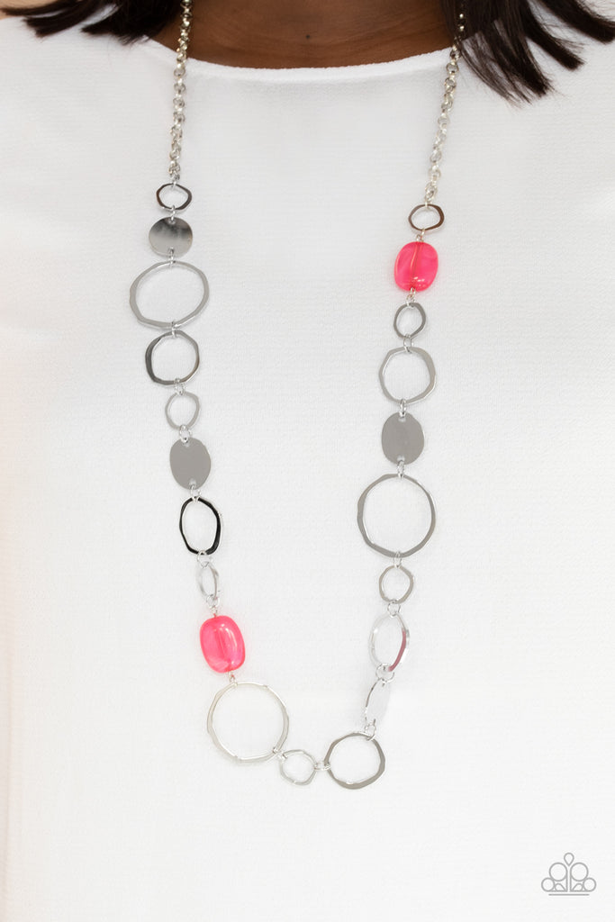 Infused with glassy pink accents, a shiny series of asymmetrical hoops and discs delicately link across the chest for a flirty pop of color. Features an adjustable clasp closure.  Sold as one individual necklace. Includes one pair of matching earrings.