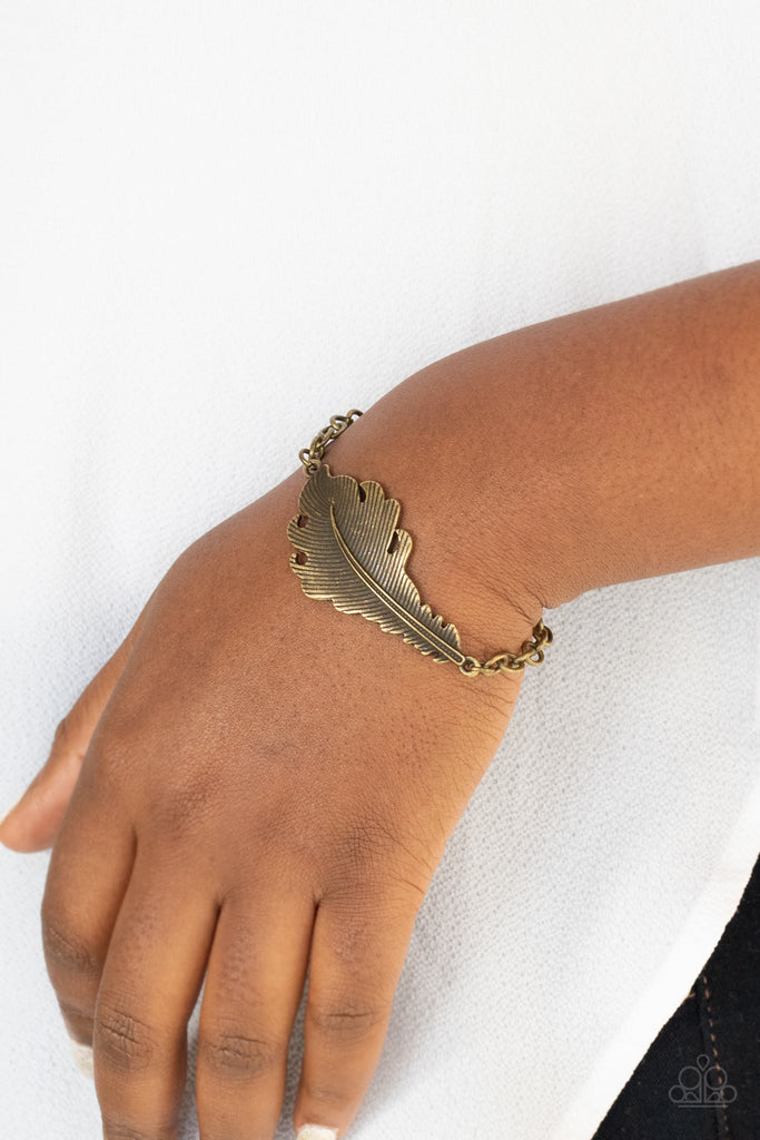 Etched and embossed in lifelike detail, a rustic brass feather centerpiece attaches to an antiqued brass chain around the wrist. Features an adjustable clasp closure.  Sold as one individual bracelet.