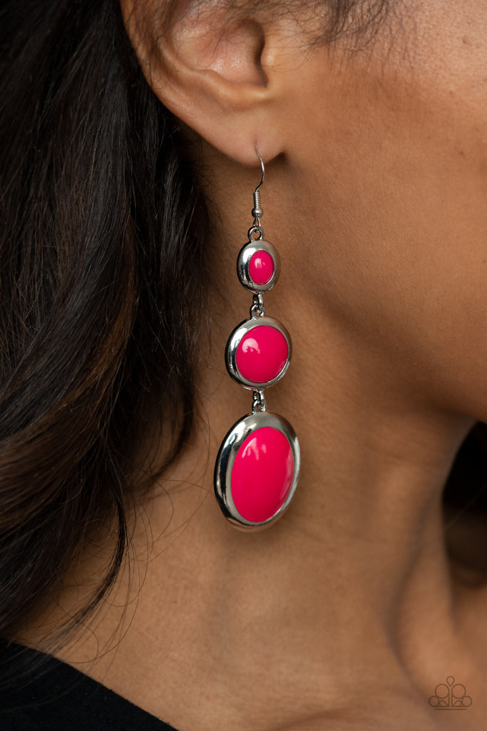 Mismatched glassy pink beads are encased in sleek silver frames that whimsically link into a colorfully retro lure. Earring attaches to a standard fishhook fitting.  Sold as one pair of earrings.  