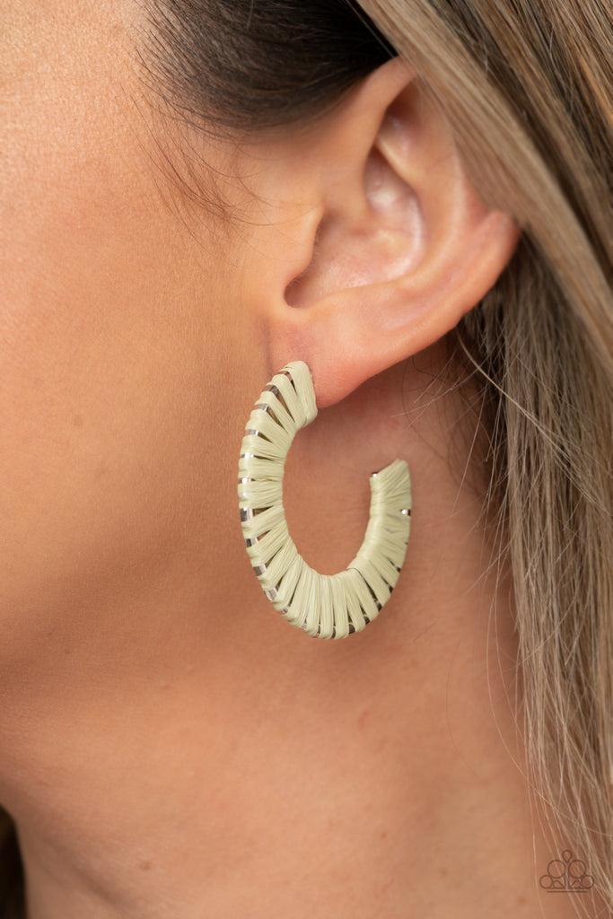 Green wicker-like cording wraps around a thick silver hoop, creating a flirty pop of color. Earring attaches to a standard post fitting. Hoop measures approximately 1 1/2" in diameter.  Sold as one pair of hoop earrings.