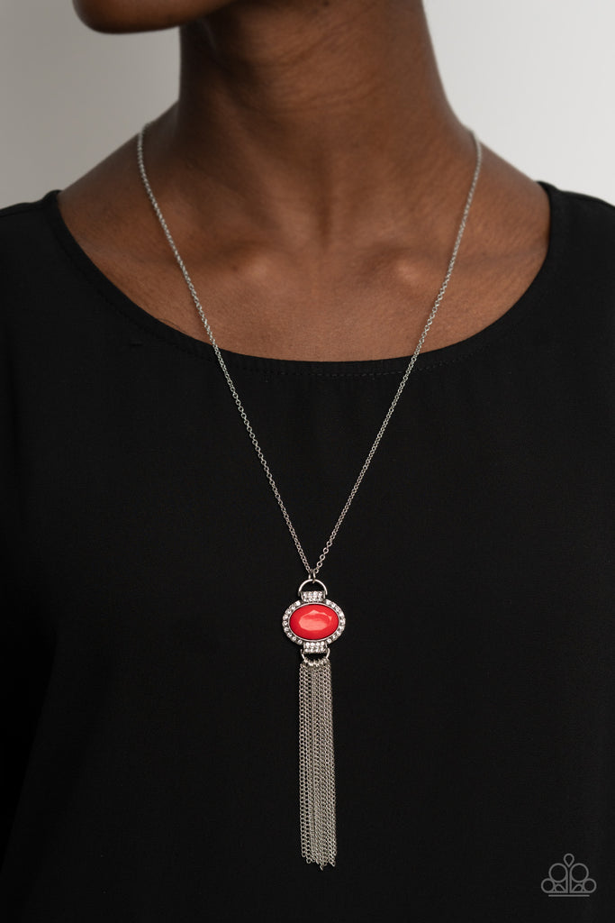 Bordered in glassy white rhinestones, a faceted red bead dotted frame gives way to a curtain of shimmery silver chains, creating a glamorous pendant. Features an adjustable clasp closure.  Sold as one individual necklace. Includes one pair of matching earrings.