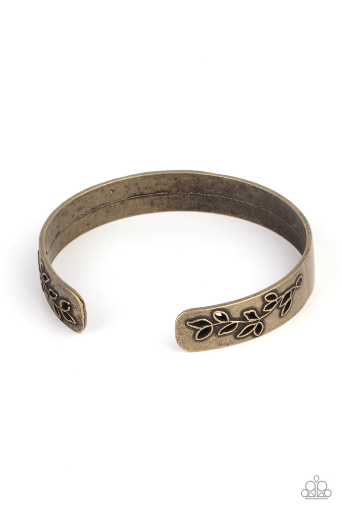 The ends of a dainty brass cuff are cut out and embossed in rustic leafy filigree, creating a simple seasonal centerpiece around the wrist.  Sold as one individual bracelet.