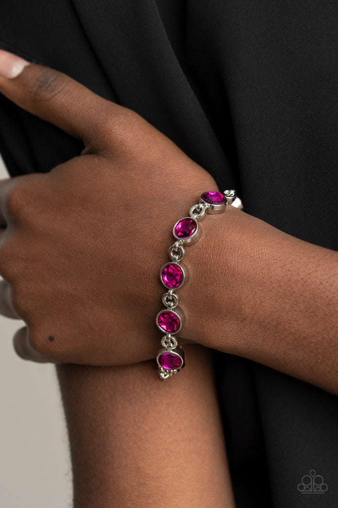 Classic pink rhinestone encrusted silver frames delicately link around the wrist, creating a timeless centerpiece. Features an adjustable clasp closure.  Sold as one individual bracelet.  New Kit