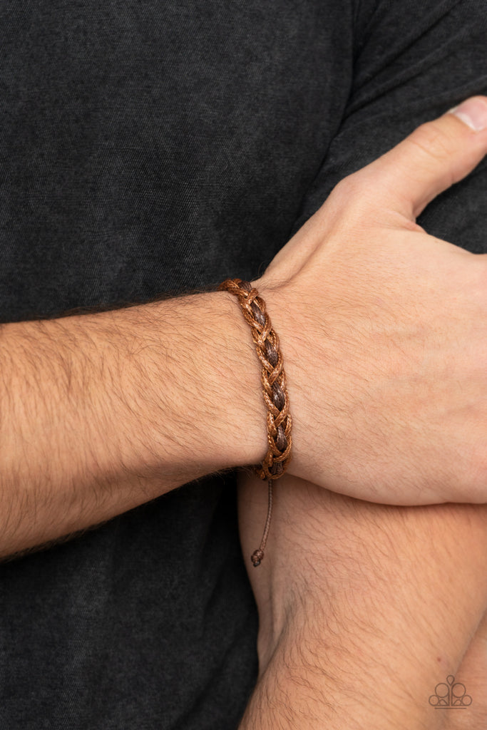 Tan cording weaves around a pair of brown cording, creating an earthy braid around the wrist. Features an adjustable sliding knot closure.  Sold as one individual bracelet.  
