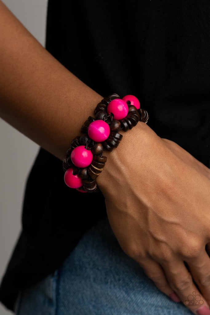 Oversized pink wooden beads, rustic brown wooden beads, and dainty wooden discs are ornately threaded along braided stretchy bands around the wrist, creating a summery centerpiece.  Sold as one individual bracelet.  New Kit