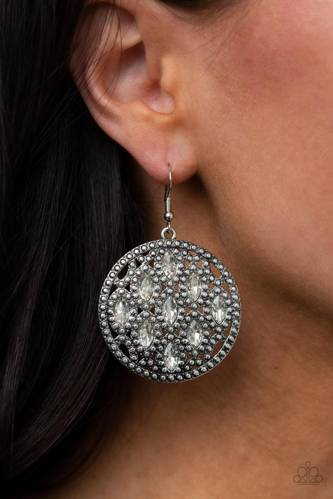 Featuring regal marquise cuts, glassy white rhinestones embellish the front of a studded silver frame, creating a stunning statement piece. Earring attaches to a standard fishhook fitting.  Sold as one pair of earrings.