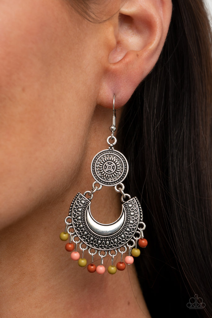 Dainty green, Rust, and Burnt Coral beads dangle from the bottom of a decorative silver crescent plate that links to the bottom of an ornately embossed silver disc, creating a colorful fringe. Earring attaches to a standard fishhook fitting.  Sold as one pair of earrings.  