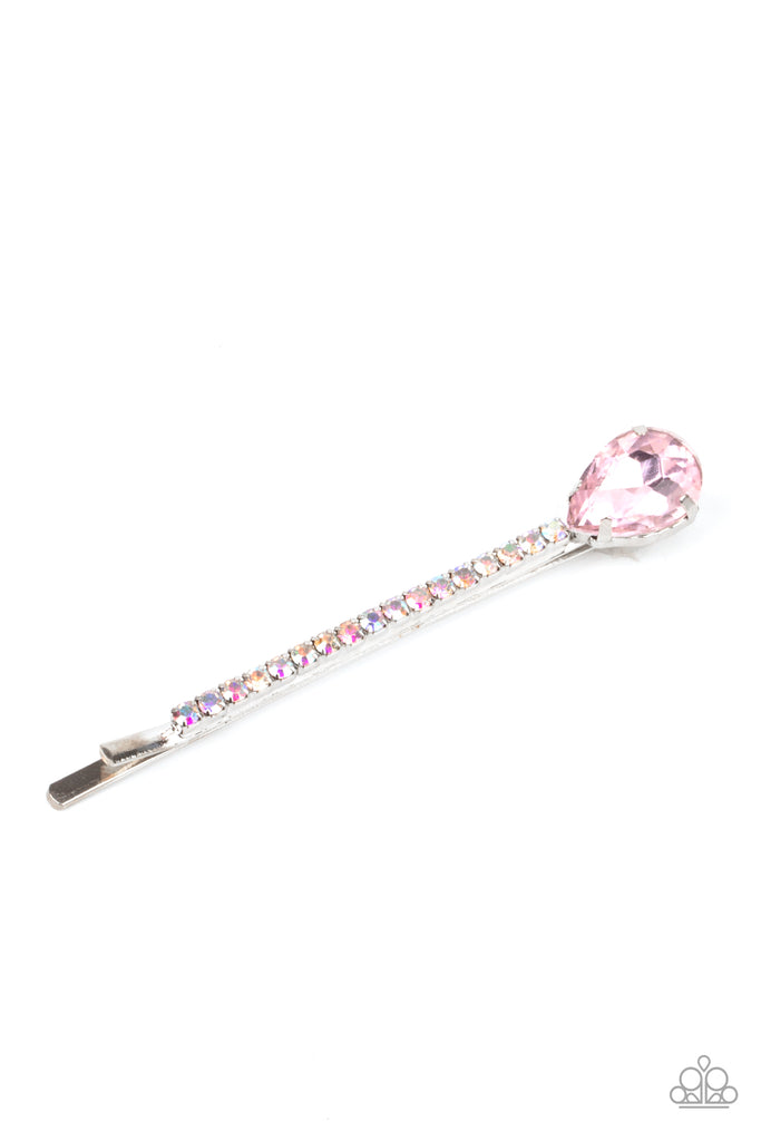 A pink teardrop gem adorns the corner of a bobby pin that is adorned in opalescent rhinestones for a glamorous finish.  Sold as one individual decorative bobby pin.
