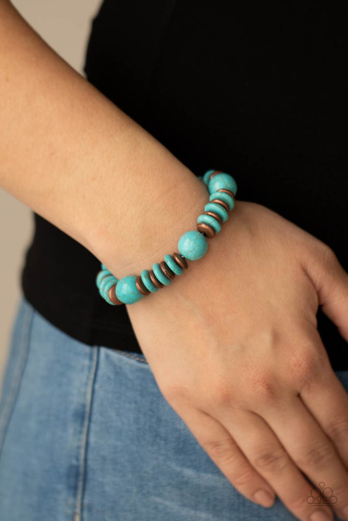 Disc shaped turquoise stones and coppery beads join oversized turquoise stone beads along a stretchy band, creating a rustic centerpiece around the wrist.  Sold as one individual bracelet.