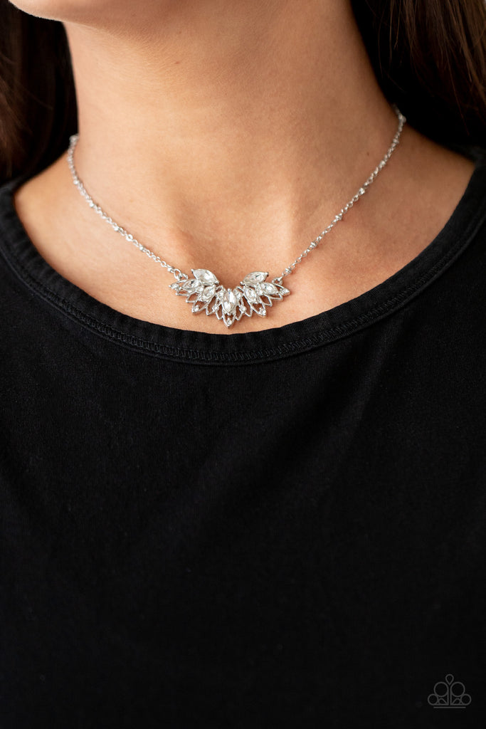 Dotted in a dainty collection of classic round and regal marquise cut rhinestones, airy silver petals fan out below the collar, creating a stunning pendant. Features an adjustable clasp closure.  Sold as one individual necklace. Includes one pair of matching earrings.  