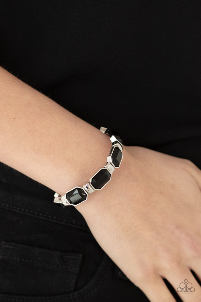Encased in sleek silver fittings, faceted black beads join dainty silver rectangular frames along stretchy bands around the wrist for a dainty pop of color.  Sold as one individual bracelet.  